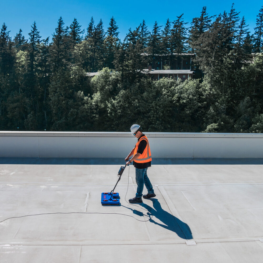 IntegriScan Electronic Leak Detection Scanning Equipment in use.